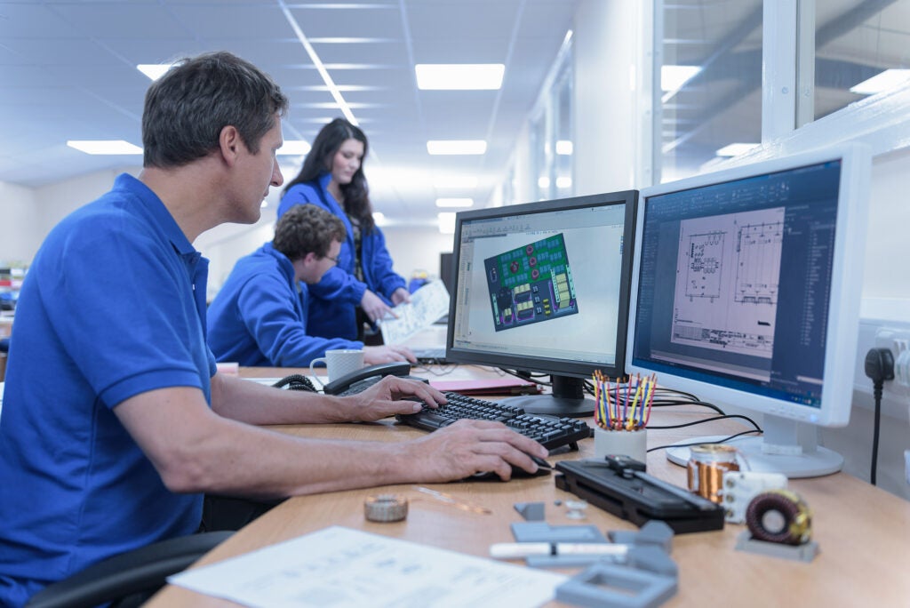 Designer using PCB design software
